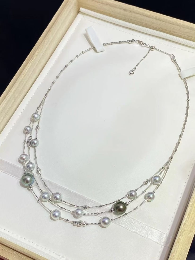 S925 Silver Multi-layer Pearl Necklace: This necklace combines silver-blue Ma pearls with rich, lustrous Tahitian black pearls, creating a striking contrast of cool and warm luster. Crafted from S925 silver, the pearls measure 6-9mm in diam