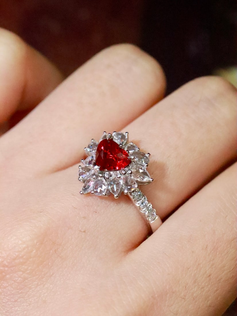 Unheated Pigeon Blood Ruby Ring: This ring features an unheated pigeon blood ruby, showcasing enchanting color and crystal brilliance. Paired with exquisite diamonds, the overall design is elegant and noble. (Main stone 1.05 carats,
