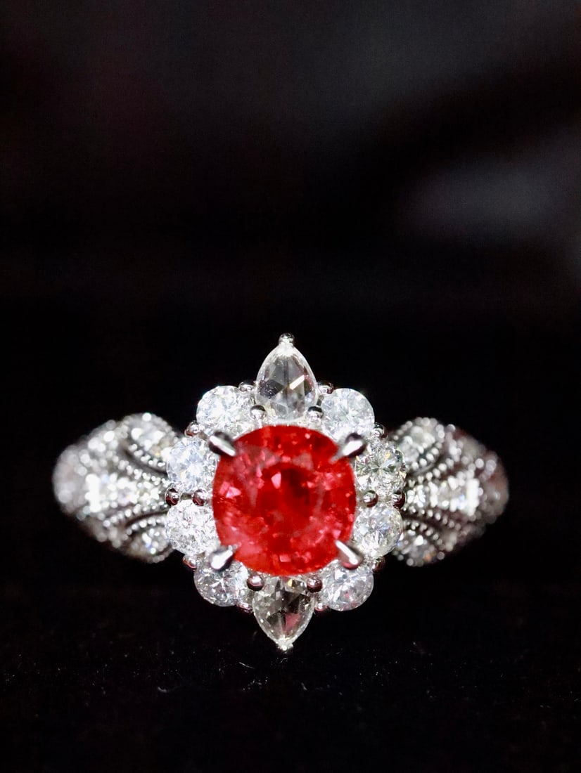 Platinum Natural Unheated Ruby Ring: Platinum outlines delicate patterns, like winding vines, gently embracing the vibrant unheated ruby. Like a dialogue of souls, it releases a subtle and enchanting charm in the interplay of light and s