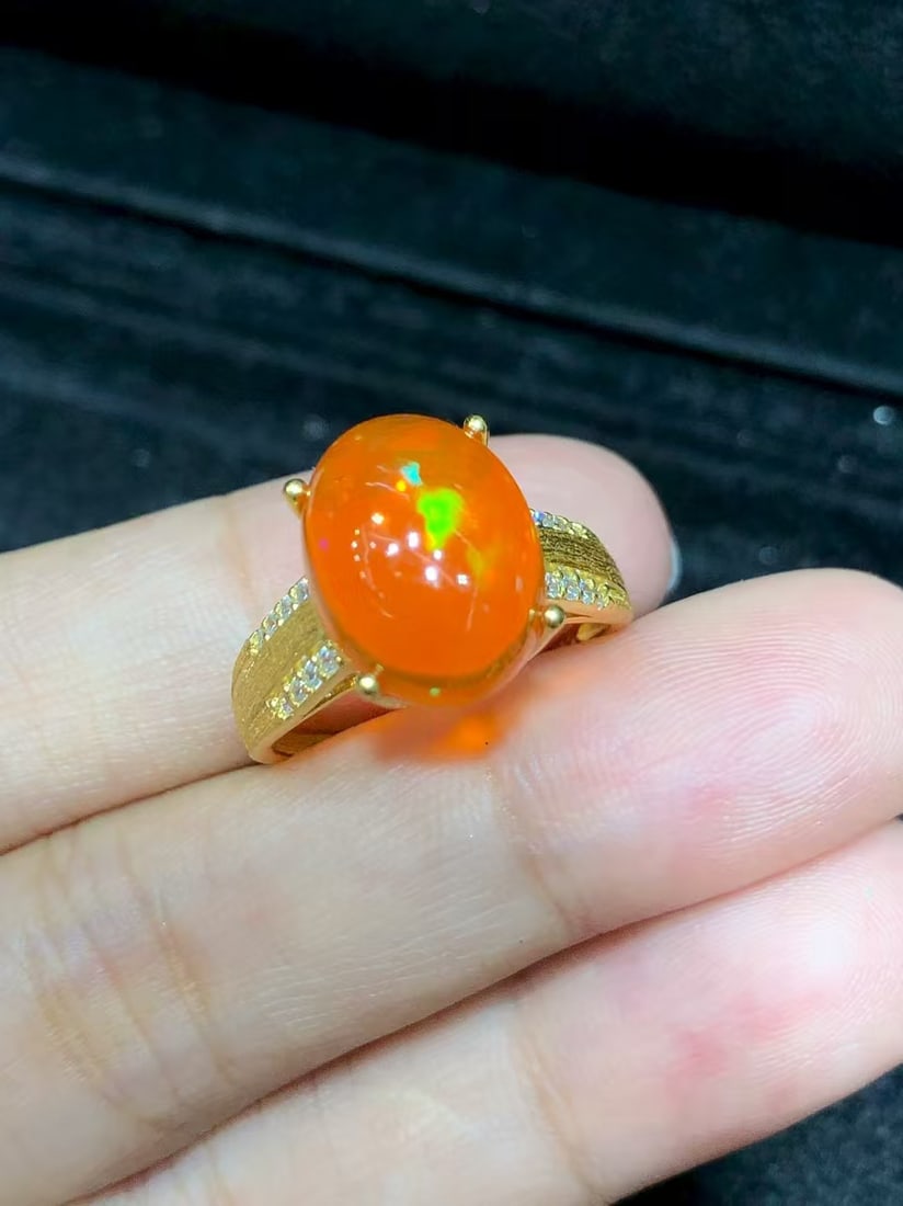Natural Fire Opal Ring: This natural fire opal ring captivates every wearer with its unique colors and luster. The main stone measures 9*11mm, expertly set in S925 sterling silver, showcasing unparalleled elegance and
