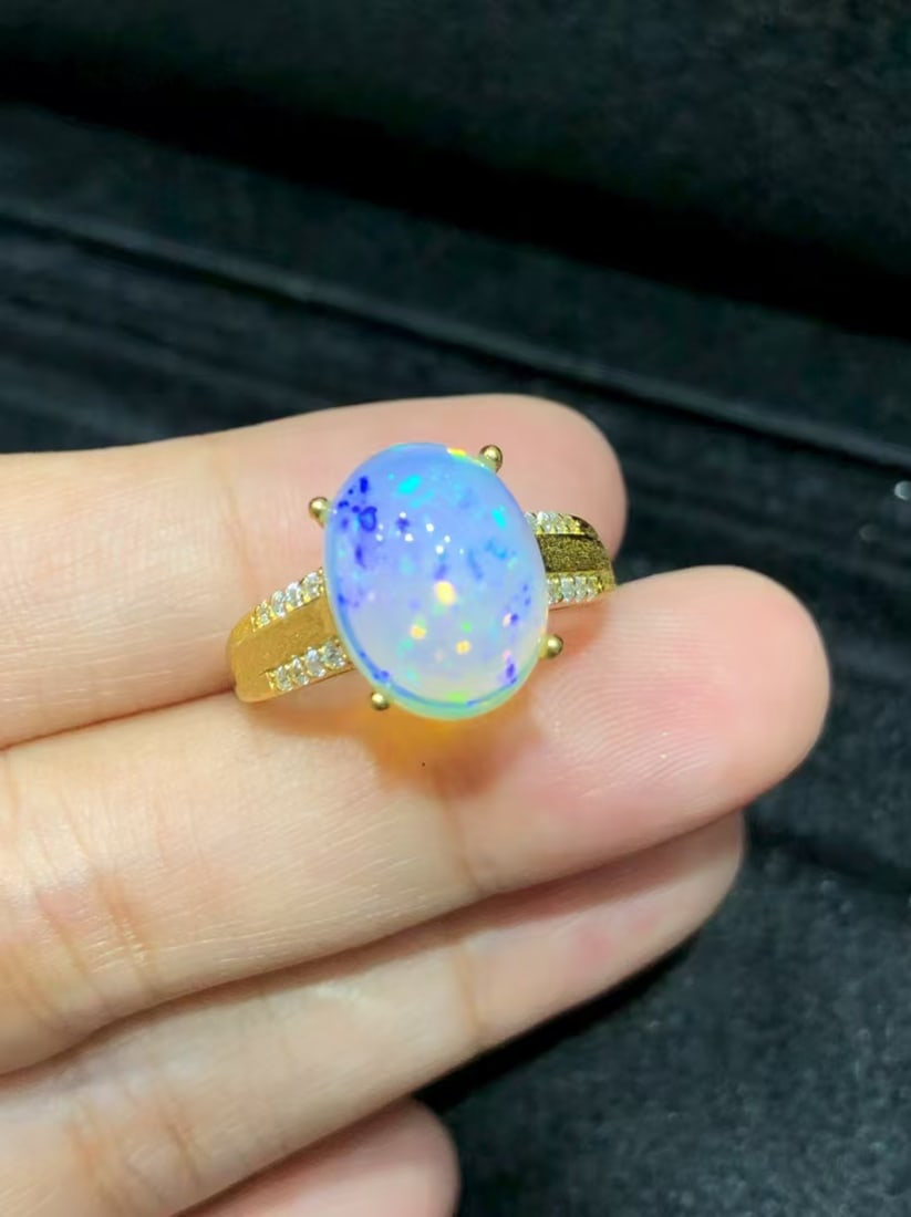 Natural Opal Ring: This natural opal ring captivates every wearer with its unique colors and luster. The main stone measures 9*11mm, showcasing the natural charm of opal. Expertly set in S925 sterling silver, it