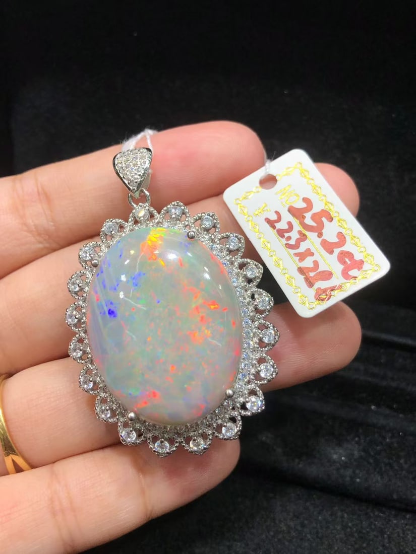 Natural Colorful Opal Pendant: This natural colorful opal pendant captivates every wearer with its unique colors and luster. The dazzling brilliance of the main stone complements the finely crafted S925 sterling silver setting,