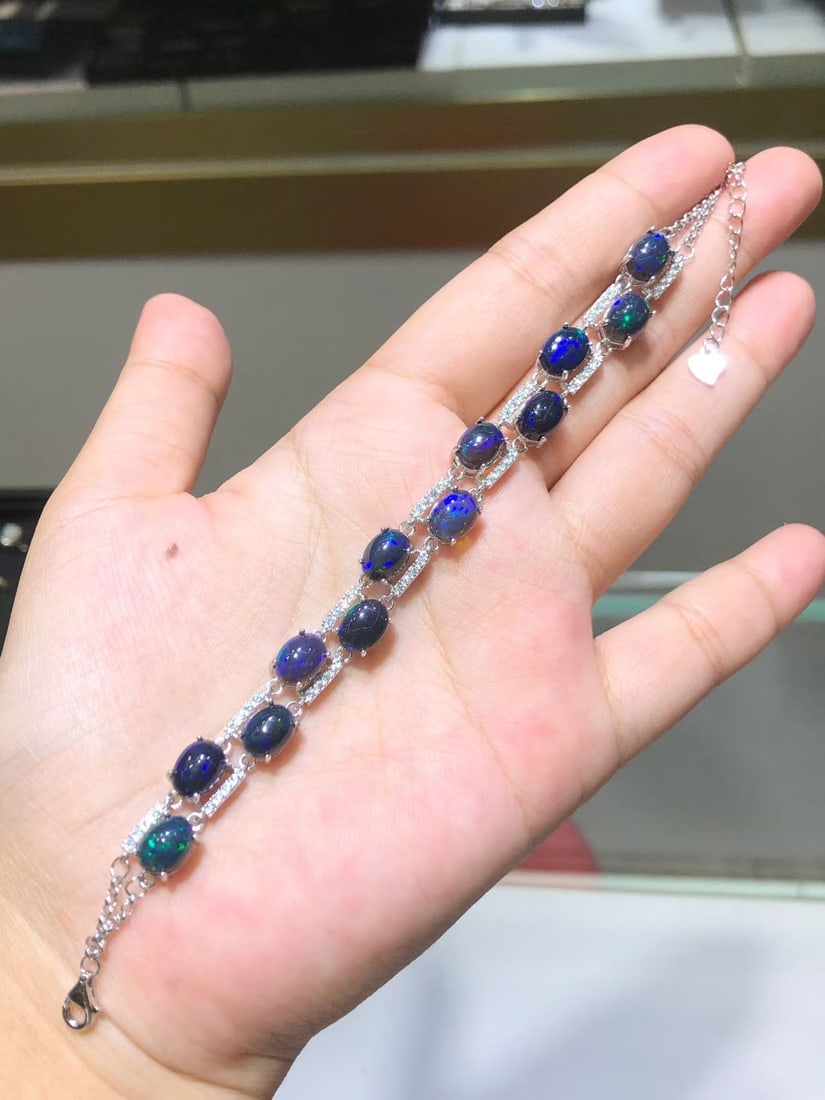 Natural Black Opal Bracelet: This bracelet features natural black opal as the main stone, showcasing a unique luster and color, complemented by S925 sterling silver craftsmanship, exuding elegance. (Main stone size 6*8mm) Freight