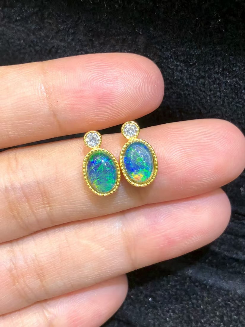 Natural Opal Earrings: These earrings feature natural opals as the main stones, showcasing unique brilliance and charm. Each main stone measures 5*7mm and is expertly set in S925 sterling silver, highlighting high-end