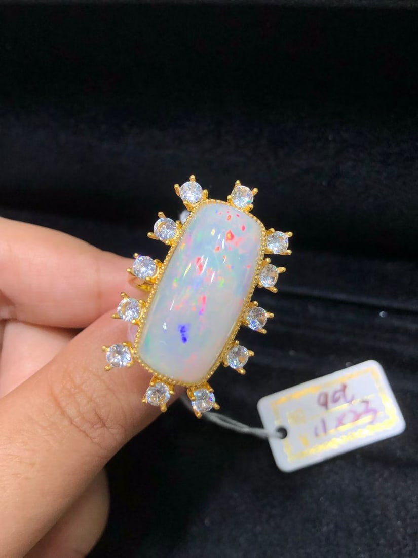 Natural Colorful Opal Ring: This natural colorful opal ring is renowned for its unique colors and exquisite craftsmanship, with the dazzling luster of the main stone captivating the heart. Set in finely crafted S925 sterling