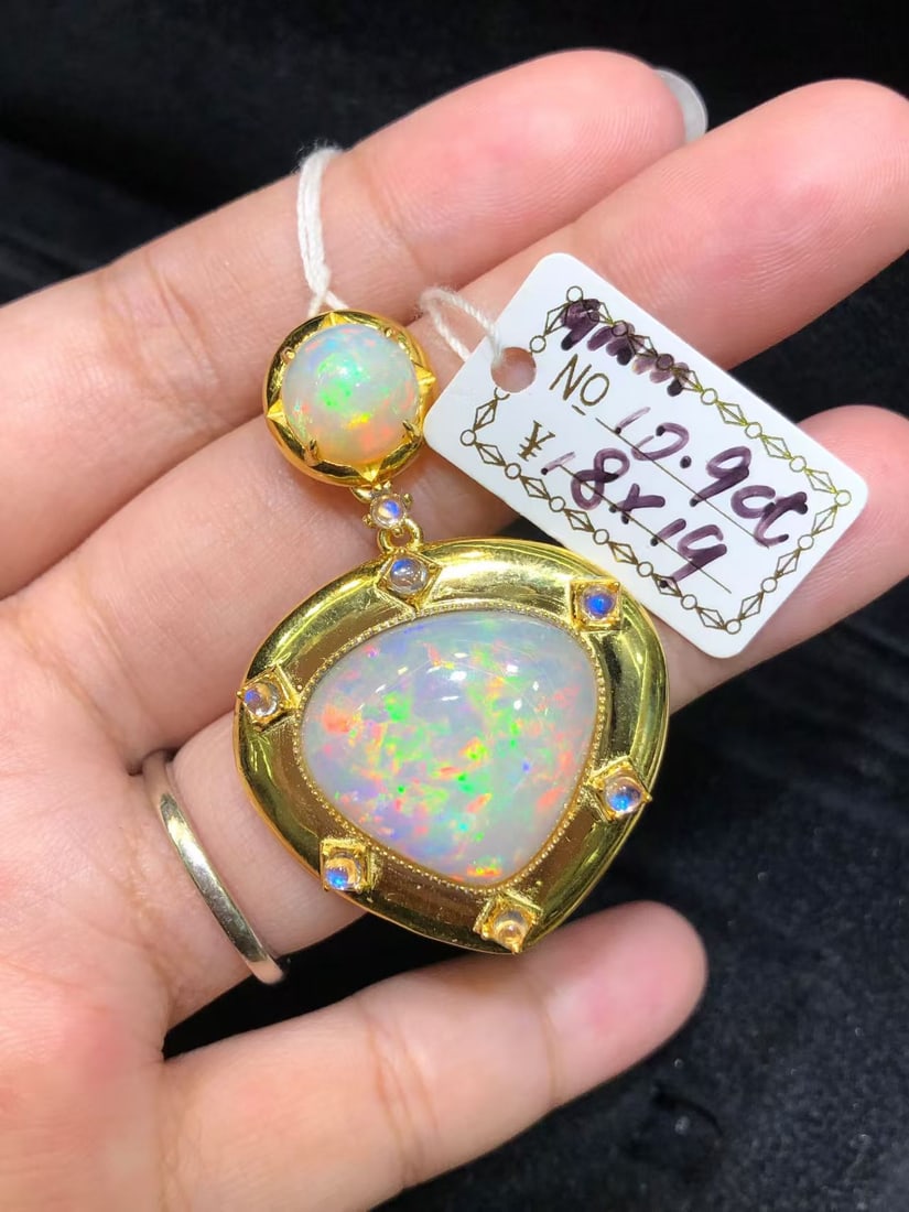 Natural Colorful Opal Pendant: This pendant features a natural colorful opal as the main stone, showcasing unique brilliance and charm, complemented by blue moonstone, exuding elegance. Expertly set in S925 sterling silver, it