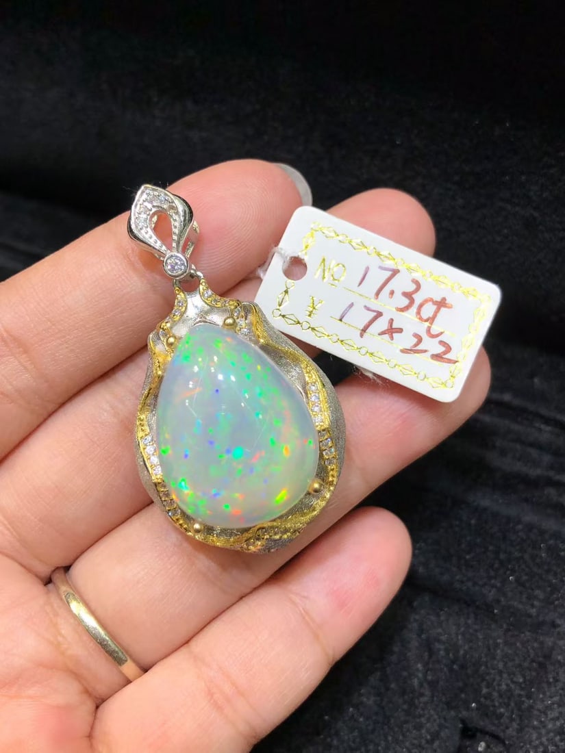 Natural Colorful Opal Pendant: This natural colorful opal pendant captivates every wearer with its unique colors and luster. The dazzling brilliance of the main stone complements the finely crafted S925 sterling silver setting,