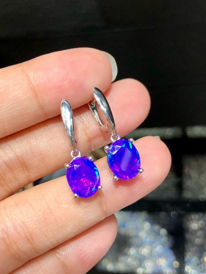 S925 Natural Colorful Purple Opal Earrings: These earrings feature colorful purple opals as the main stones, showcasing unique brilliance and charm. Each main stone measures 7*9mm and is expertly set in S925 sterling silver, highlighting an