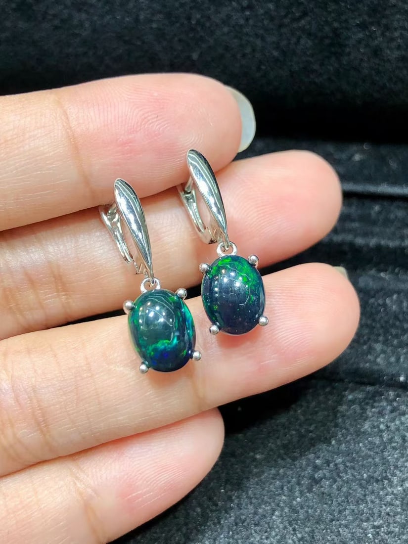 Natural Black Opal Earrings: These natural black opal earrings captivate every wearer with their unique colors and luster. The main stone measures 7*9mm and is expertly set in S925 sterling silver, showcasing a perfect blend of