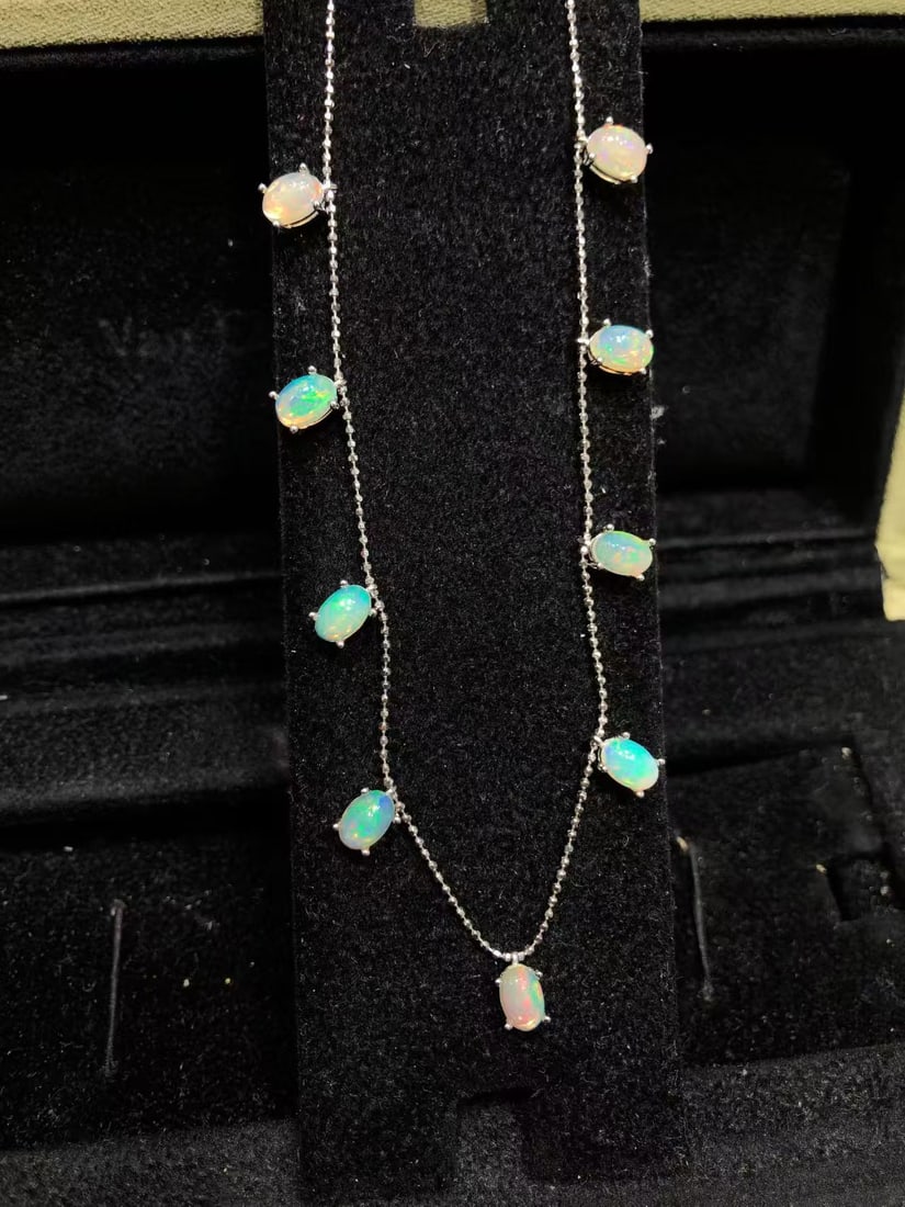 Natural Opal Starry Sky Necklace: This natural opal starry sky necklace captivates every wearer with its unique luster and dazzling colors. The main stone measures 4*6mm and is intricately set in S925 sterling silver, showcasing a