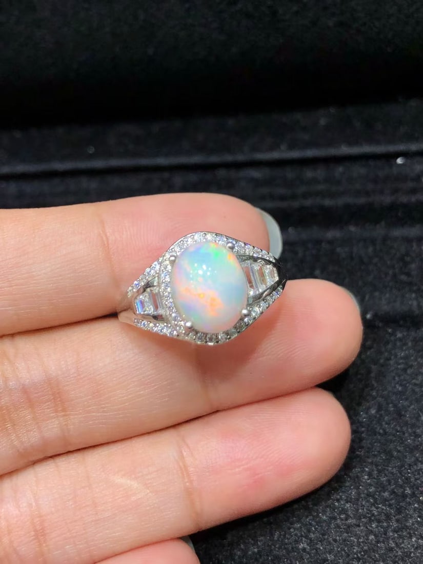 Natural Opal Ring: This natural opal ring captivates every wearer with its unique colors and luster. The main stone measures 8*10mm, showcasing the distinct charm of natural gemstones. Expertly set in S925 sterling