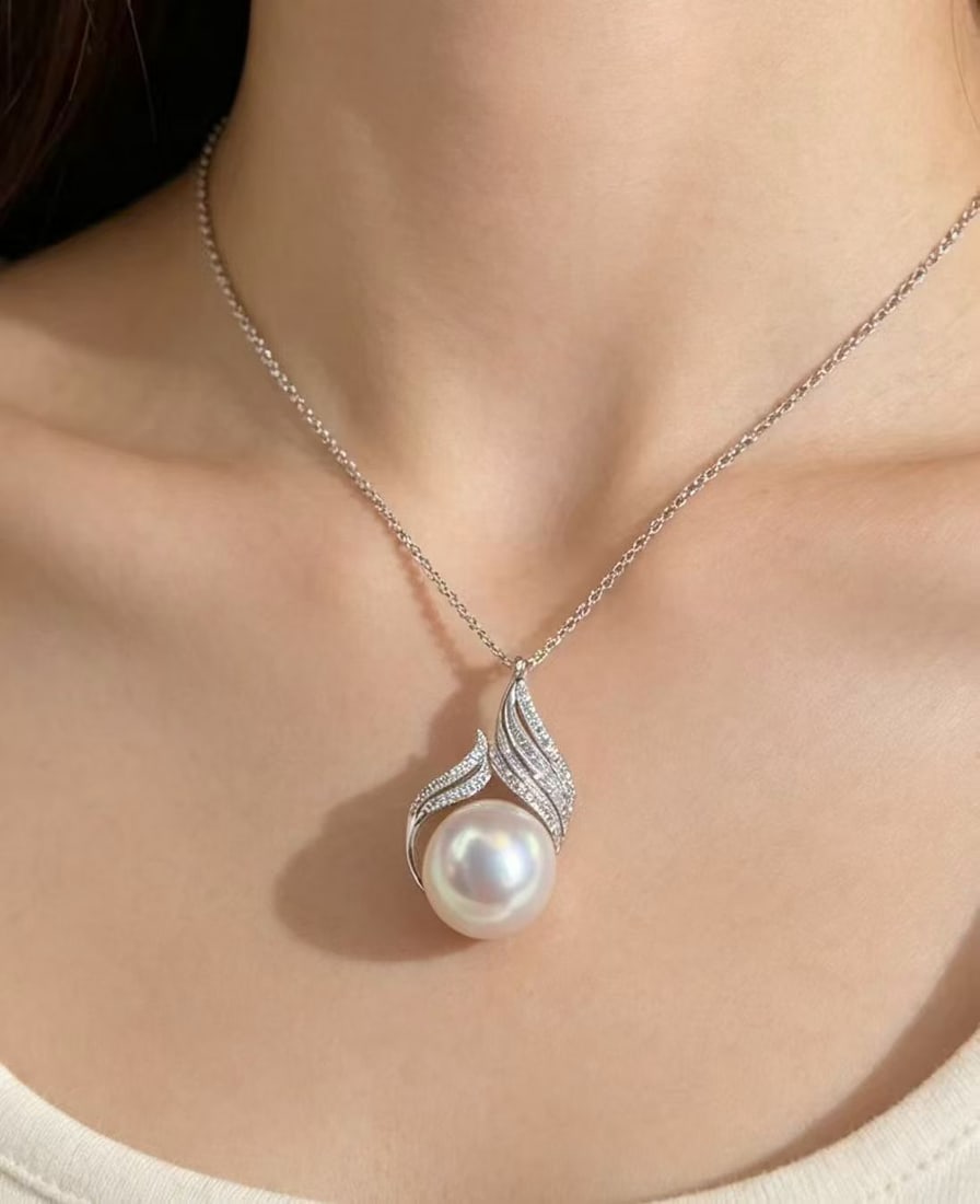 Natural White Pearl Pendant: This pearl pendant showcases its unique charm with a near-round shape and slight imperfections, presenting an extraordinary luster that captivates the heart. The 925 silver setting adds an elegant