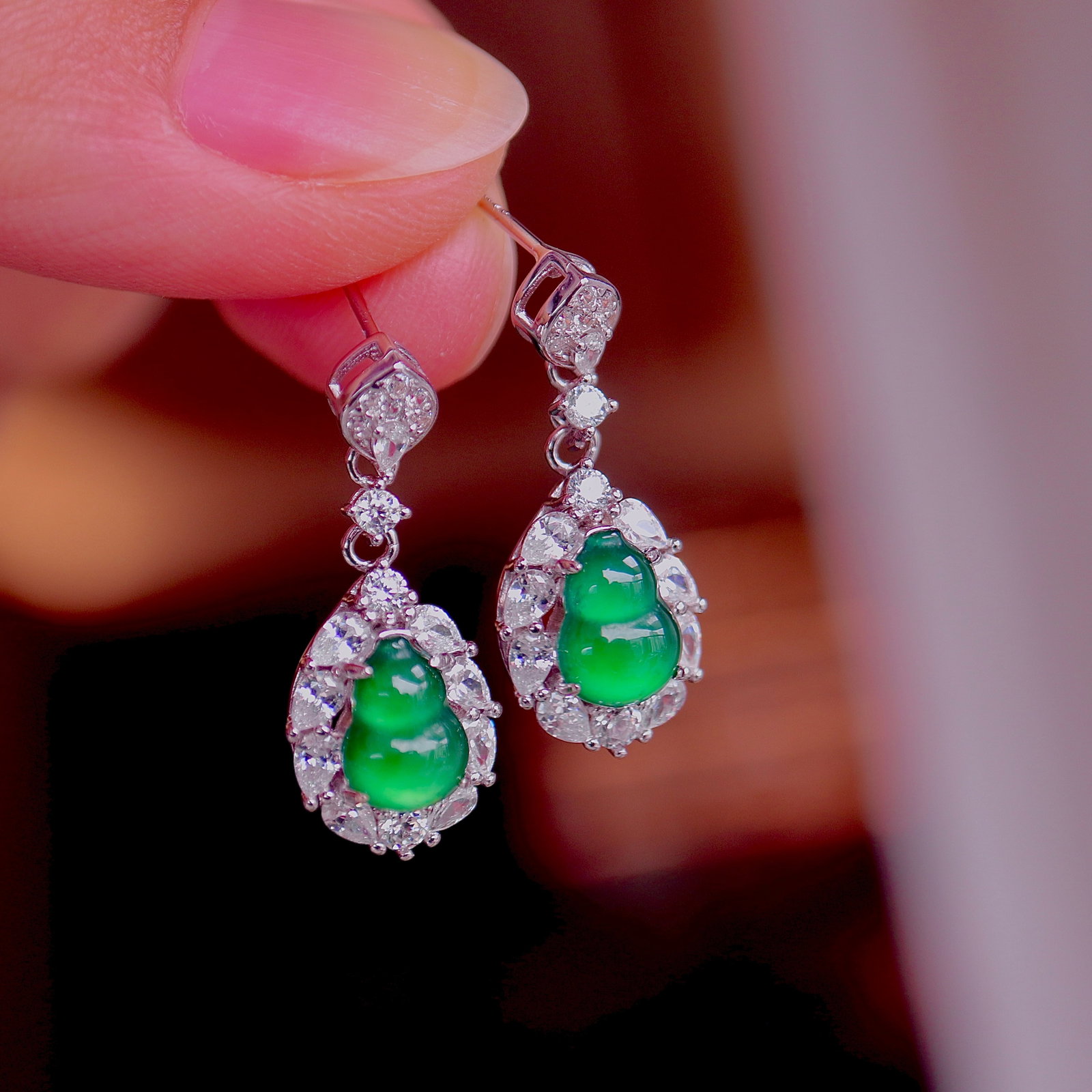 S925 Silver Natural Type A Jadeite Earrings: These earrings feature natural Type A jadeite as the main stone, showcasing an enchanting icy green hue. The gourd shape symbolizes good fortune and prosperity, with exquisite craftsmanship and a simp