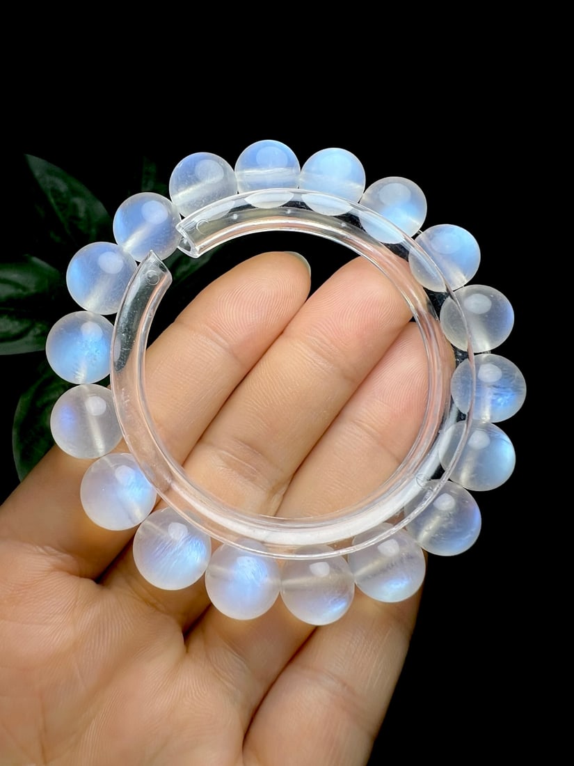 Blue Moonstone Bracelet: This blue moonstone bracelet is renowned for its transparent crystal and strong blue light, showcasing a unique creamy texture. When worn, the bracelet's elegant glow adds a charming allure to the ove