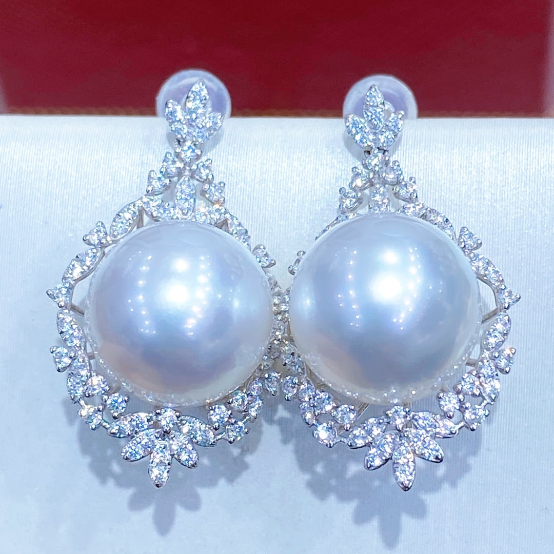 925 Silver White Pearl Earrings: These earrings are crafted from 925 silver, featuring 11 to 12mm aurora glassy white pearls with a mirror-like cool sheen. The pearls are perfectly round and flawless on the front, enhanced by a class