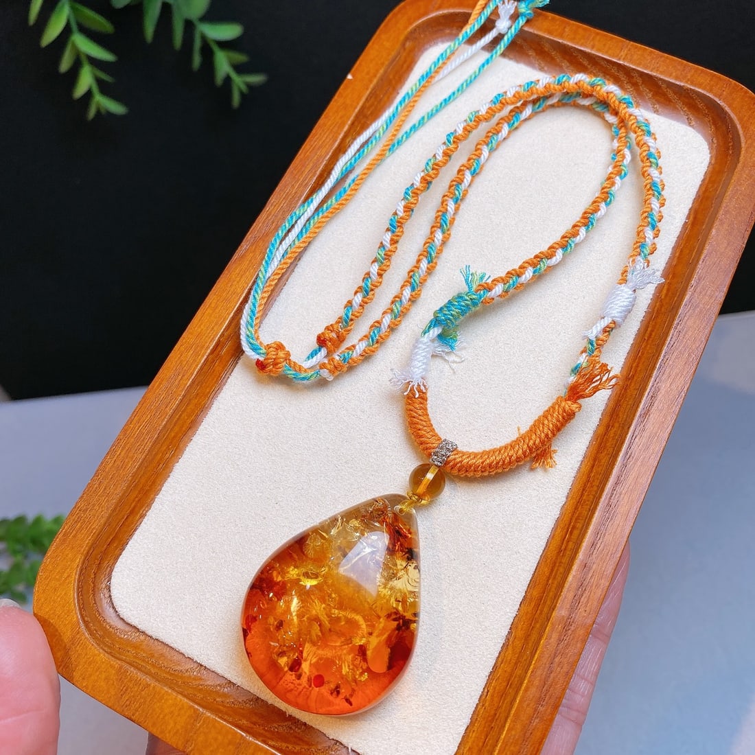 Natural Flower Amber Pendant: This natural flower amber pendant showcases a unique beauty with its teardrop shape, excellent quality, and clarity without impurities. Its simple yet elegant design makes it suitable for various occa