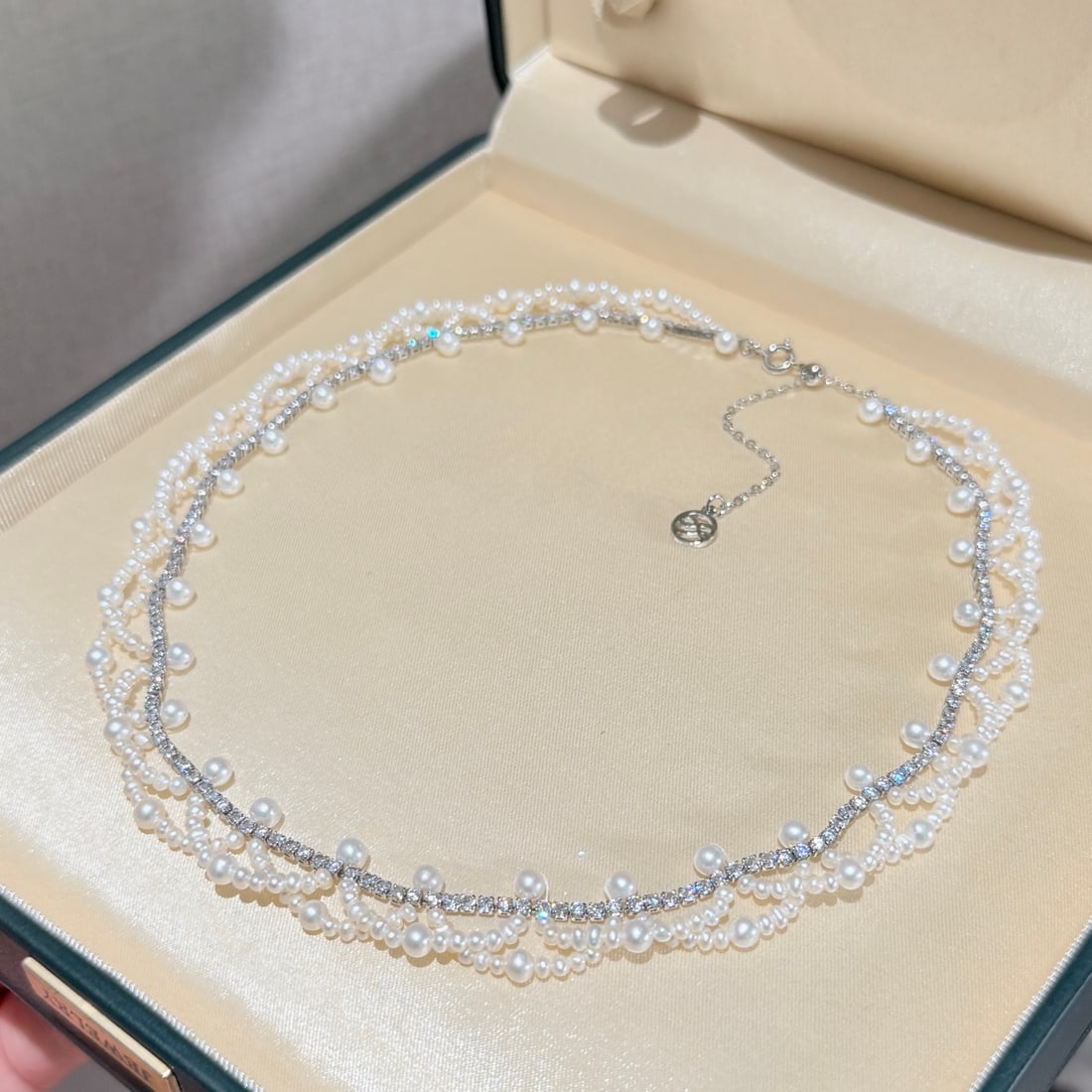 Natural Pearl Necklace: This necklace is crafted with delicate weaving, featuring staggered pearls and fine zircon stones in perfect harmony. The tail design includes an icy butterfly and a wave tail chain, adjustable for ad