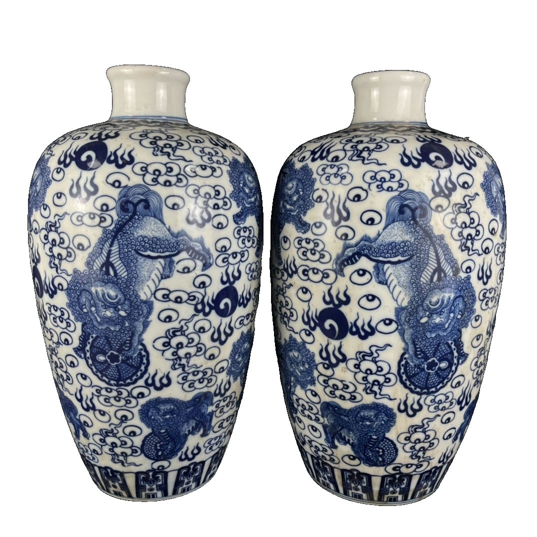 Qing Dynasty Kangxi Period Lion Playing with Ball Pattern Large Vases Pair: This pair of large vases is from the Kangxi period of the Qing Dynasty, featuring a lion playing with a ball pattern, symbolizing good fortune and auspiciousness. The elegant shape, smooth glaze, and 