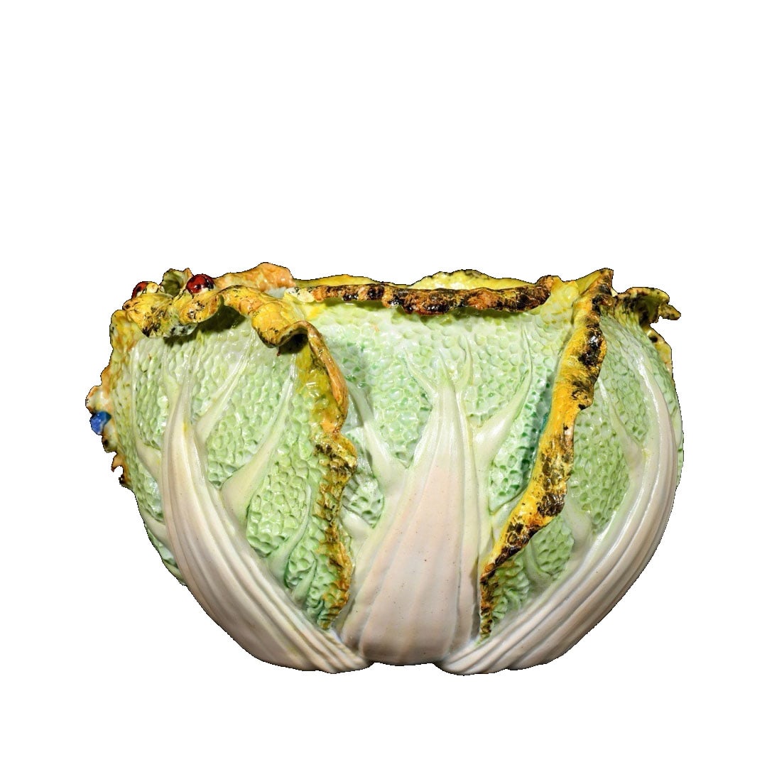 Qing Dynasty Famille Rose Carved Cabbage Brush Washer: This Qing Dynasty famille rose carved cabbage brush washer showcases exquisite craftsmanship and vivid form, symbolizing good fortune and wealth. Its vibrant colors and meticulous detailing reflect th