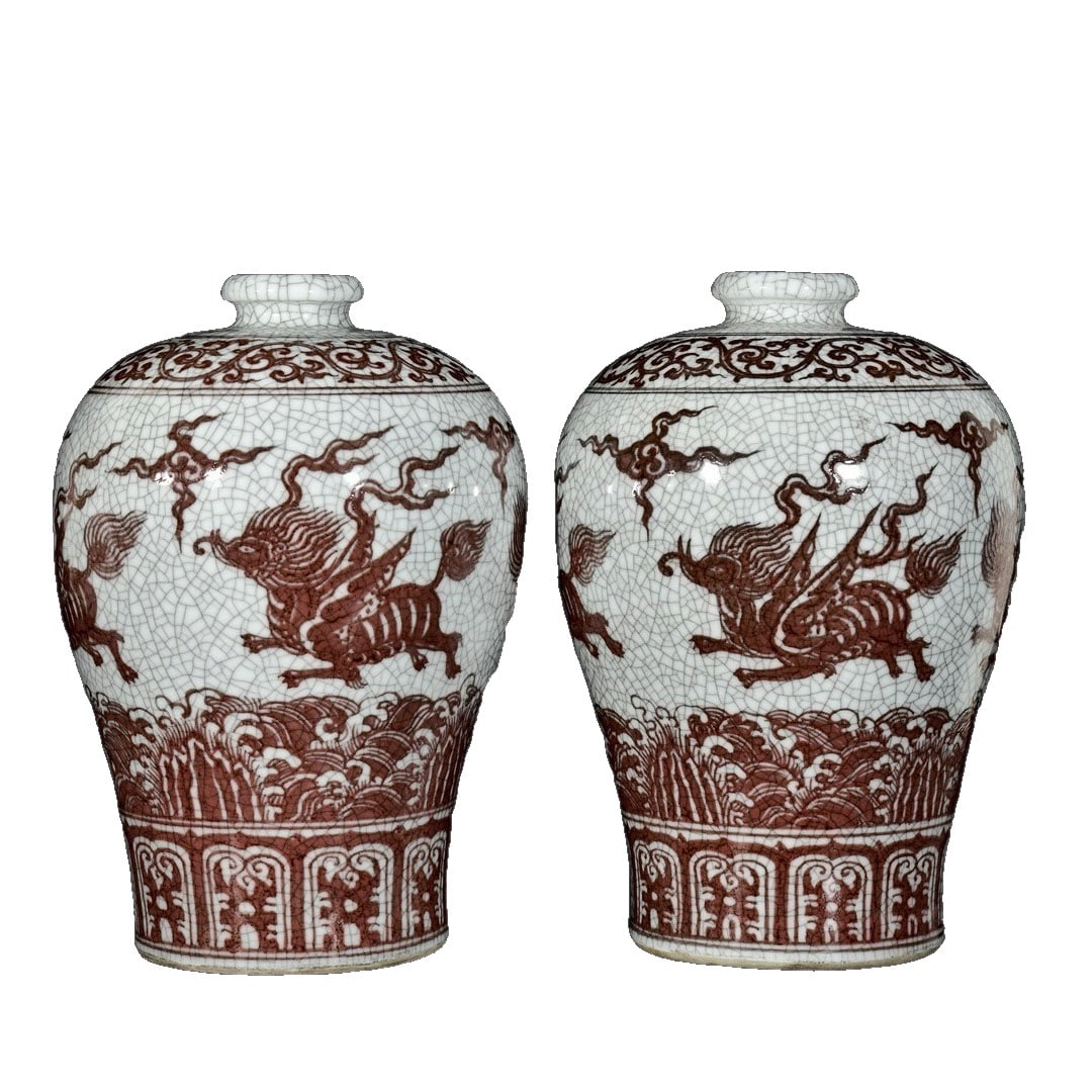 Ming Dynasty Glazed Red Openwork Sea Beast Pattern Mei Vase Pair: This pair of Mei vases is exquisitely crafted using glazed red technique, featuring a unique openwork sea beast pattern that showcases the superb craftsmanship and aesthetic appeal of Ming Dynasty cer