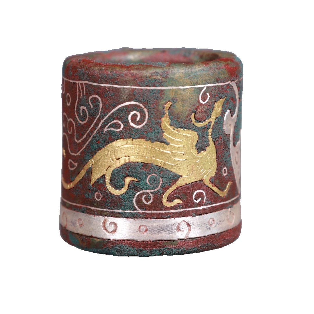 Warring States Han Bronze Ring with Gold and Silver Inlay of Flying Birds and Auspicious Beasts: This Warring States Han bronze ring features a unique surface with red spots and green rust skin, showcasing exquisite craftsmanship. The gold and silver inlay technique vividly depicts flying birds a
