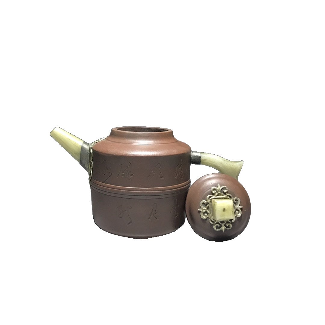 Qing Dynasty Yixing Zisha Teapot with Jade Handle and Spout: This Zisha teapot made by Yang Pengnian features a clear mark and unique craftsmanship, with a body that is simple yet elegant, showcasing the exquisite skills of a master potter. The teapot is design