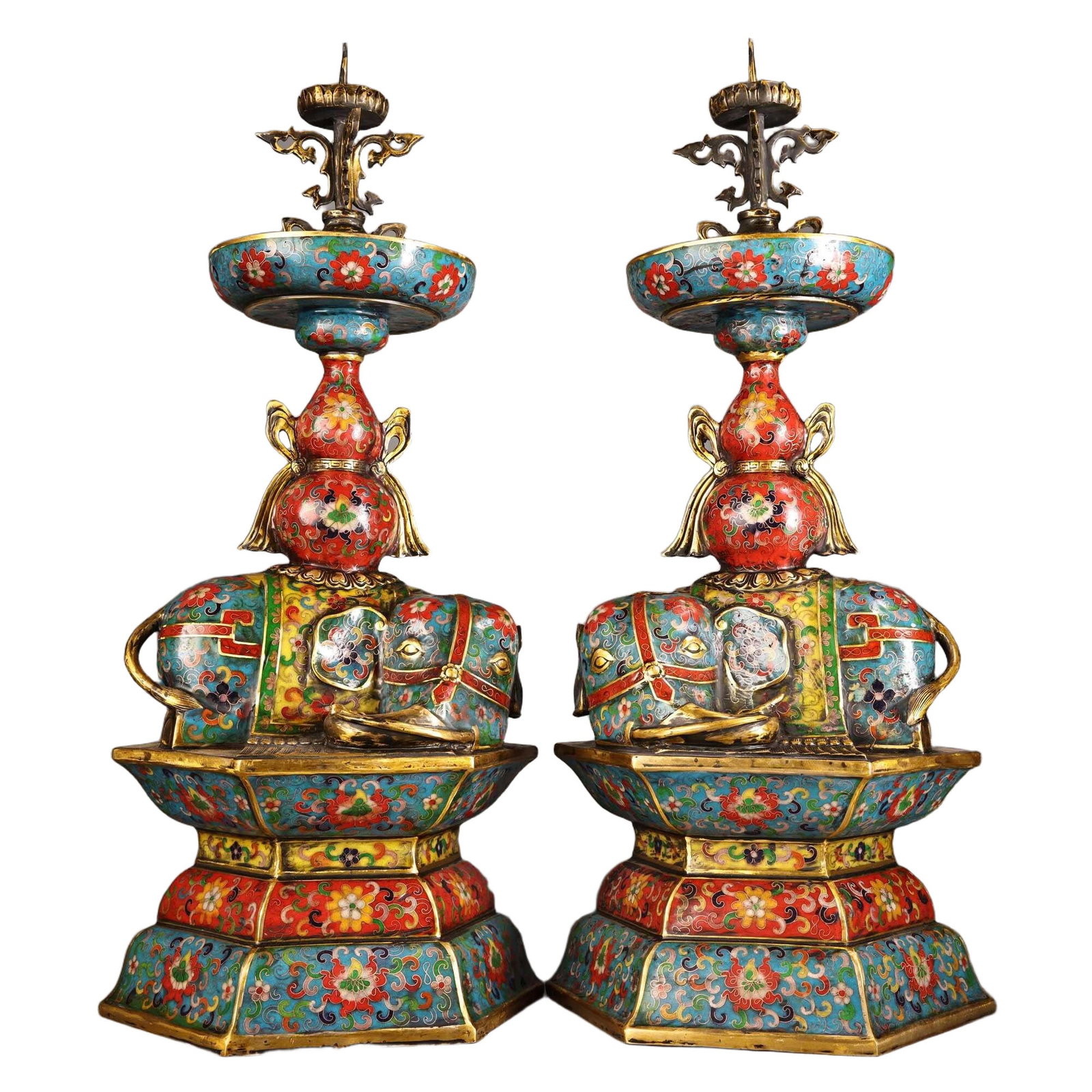 Gilded Copper Cloisonne Enamel Pair of Peaceful Elephant Candle Holders: This pair of candle holders is made of pure copper, featuring exquisite craftsmanship and intricate relief carving, showcasing the peaceful symbolism of the elephants. The elegant shape makes it