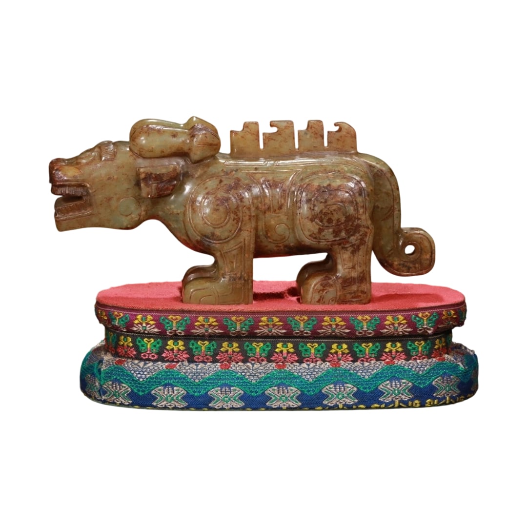 Ancient Hetian Jade Tiger Ornament: This ancient Hetian jade tiger ornament features exquisite carving and a vivid form, symbolizing majesty and the power to ward off evil. The jade quality is smooth and the color is gentle, showcasing 