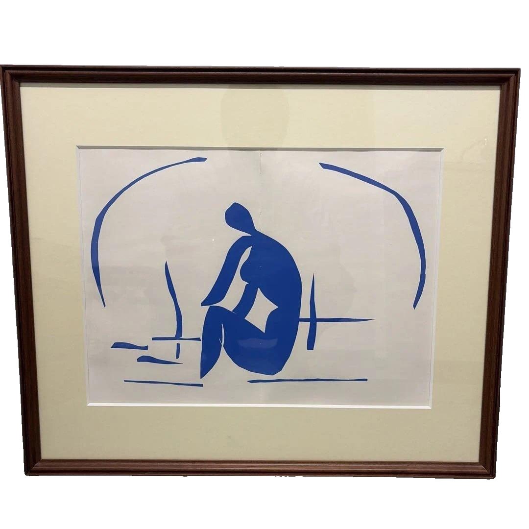 Henri Matisse, "Blue Nude," framed lithograph.: Framed Lithograph of "Blue Nude" by Henri Matisse This is a framed work of the cut-out piece "Blue Nude" by Henri Matisse, depicted with vibrant blue colors and bold curves. It is believed to be an "o
