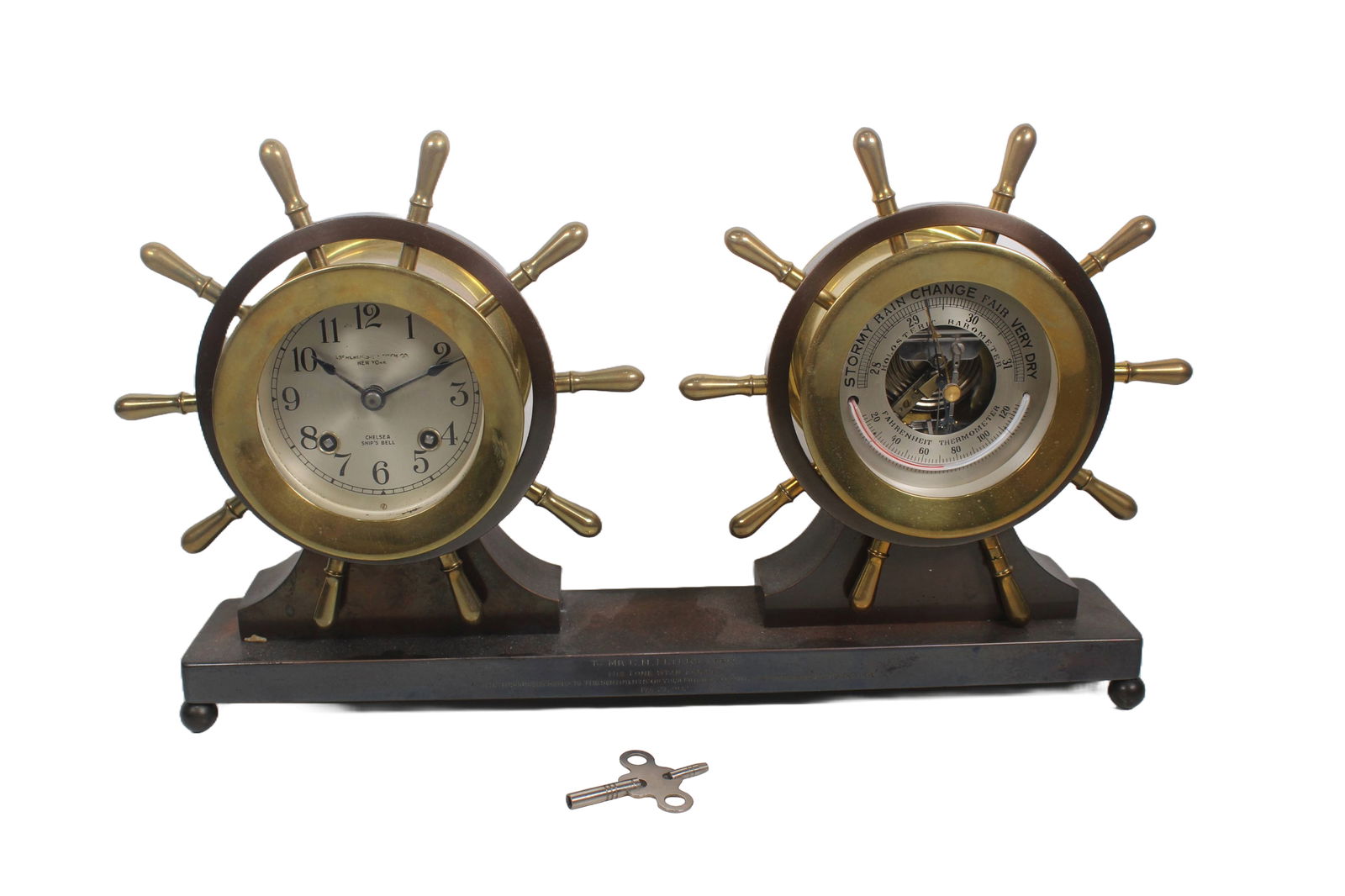 CHELSEA CLAREMONT DESK CLOCK WITH BAROMETER AND THERMOMETER, CIRCA 1930: Chelsea Claremont Model Ships Wheel desk clock with holosteric barometer and Fahrenheit thermometer in matching brass case on “E” finished copper bronze base. The clock and barometer have 3-3/