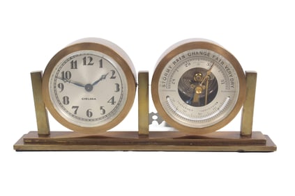 CHELSEA DESK CLOCK AND BAROMETER IN SWIVEL MOUNTED BASE, CIRCA 1940