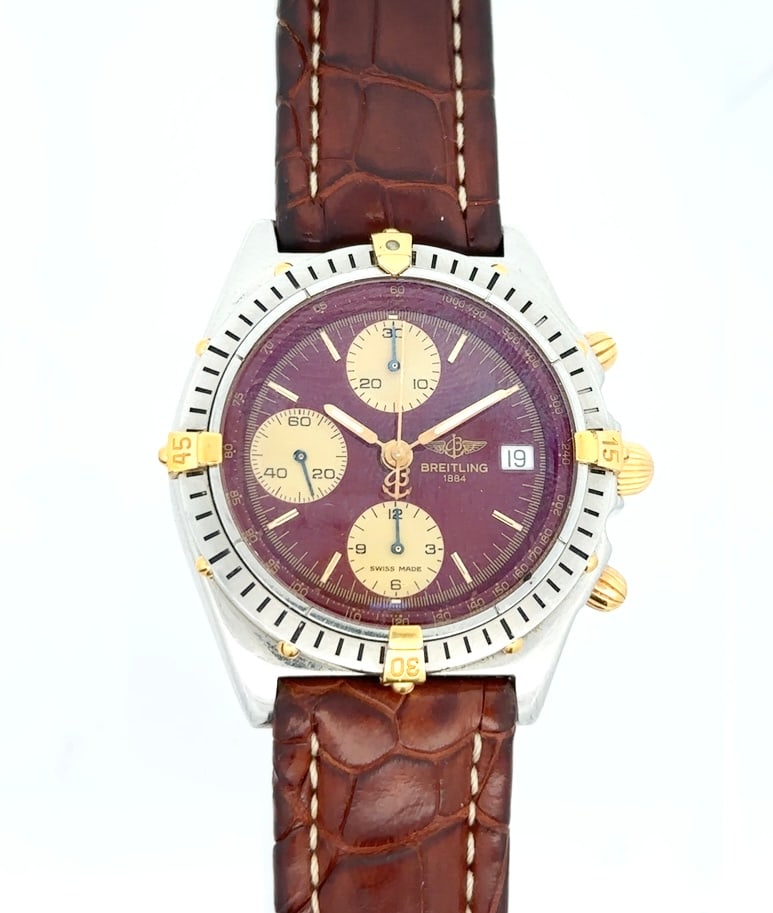 BREITLING CHRONOMAT REF. B13048 CHRONOGRAPH WRISTWATCH: Breitling Chronomat Ref. B13048 Mens Chronograph Wristwatch In Stainless Steel With Gilt Accents And Chocolate Brown Dial. The watch has a 25 jewel Breitling caliber 13 automatic movement with 3 regis