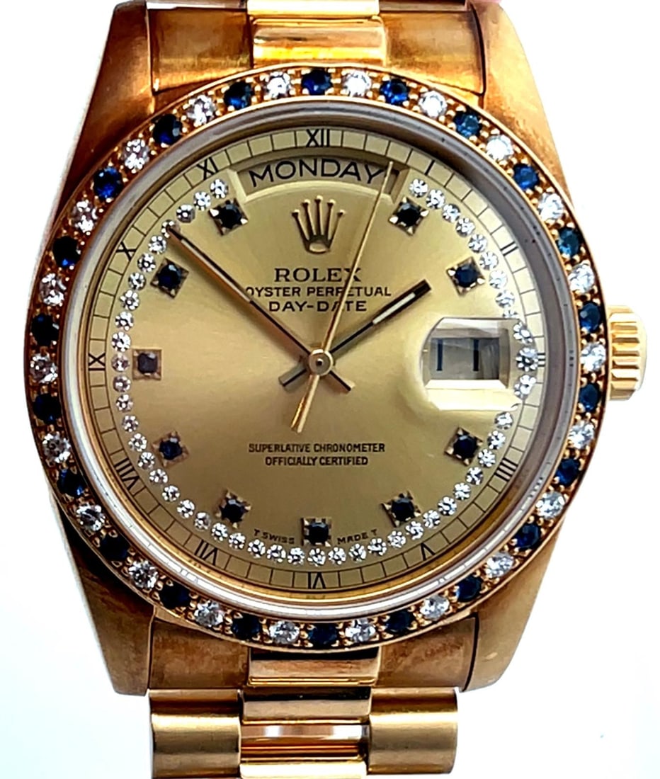 ROLEX REF. 18148 DAY - DATE PRESIDENT 18K WRISTWATCH WITH FACTORY SAPPHIRE AND DIAMOND STRING DIAL: SPLIT Ref. 18148 Day - Date President Model 18K Yellow Gold Mens Wristwatch With Factory Sapphire and Diamond String Dial and Factory Sapphire and Diamond Bezel. The watch has the 27 jewel chronometer