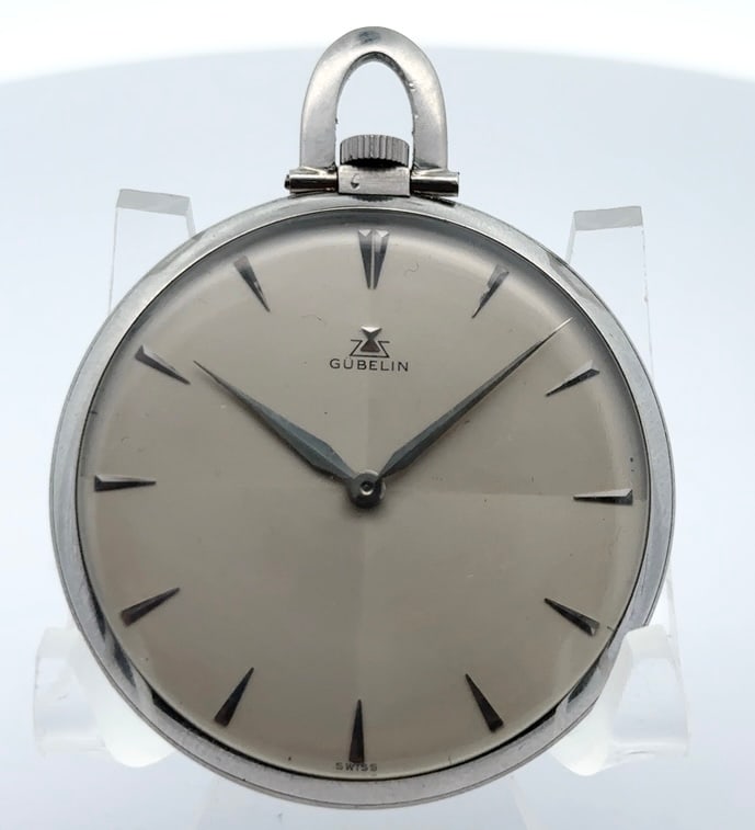 GUBELIN PLATINUM ULTRA THIN DRESS POCKET WATCH, CIRCA 1950: Gubelin Platinum Ultra Thin Mens Dress Pocket Watch. The watch has an 18 jewel ultra thin pendant wind and set nickel bridge plate movement signed Gubelin. The watch has a two color silvered metal dia