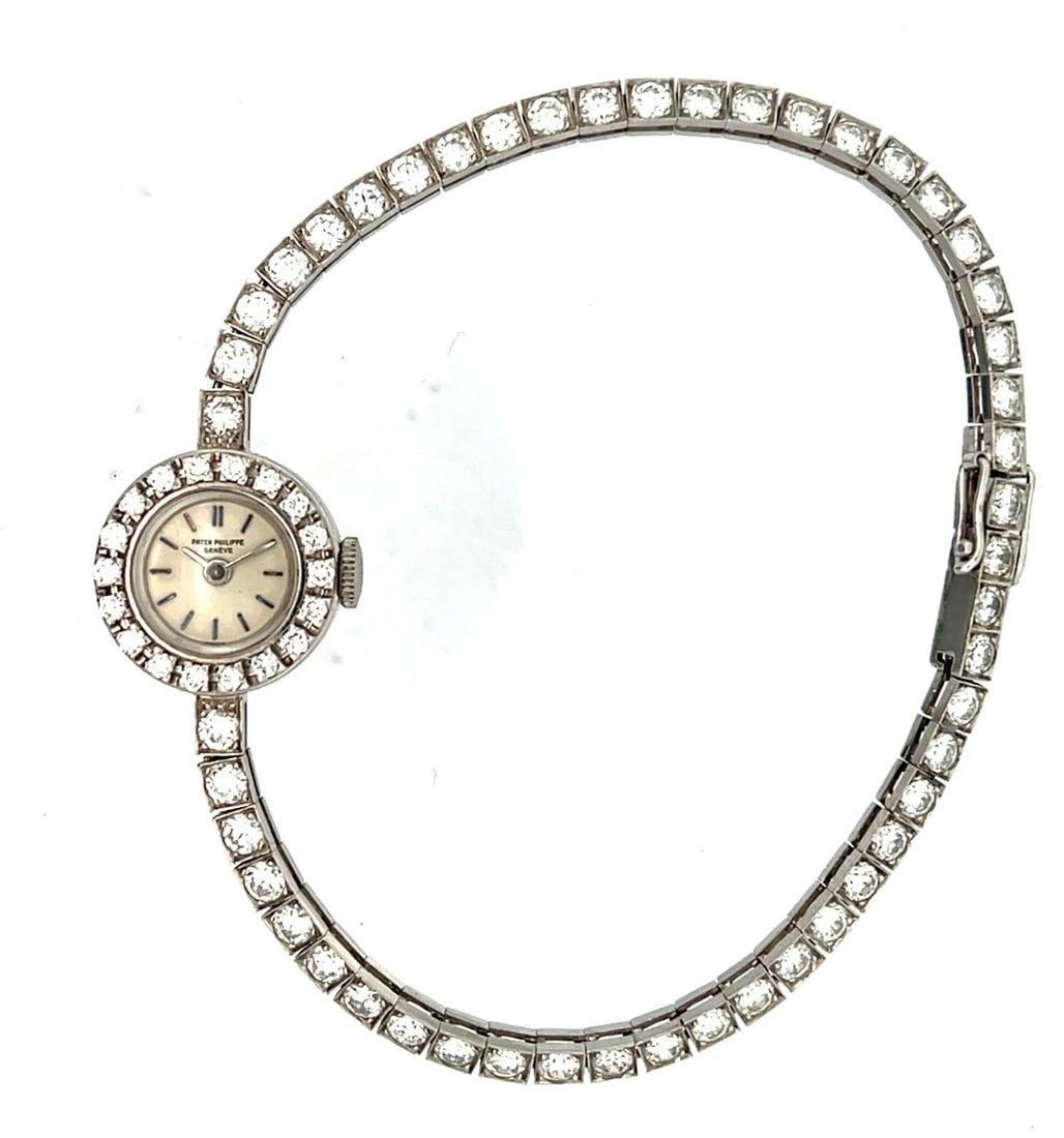 PATEK PHILIPPE PLATINUM AND DIAMOND REF. 3267/21 WRISTWATCH, CIRCA 1962 (1 of 13)