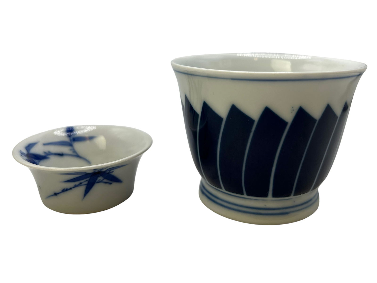 Two Blue And White Cups: H : 2 3/4 in ( 6.99 cm ) W : 3 1/2 in ( 8.9 cm ) H : 1 1/8 in ( 2.86 cm ) W ; 2 1/2 Iin ( 6.35 cm )