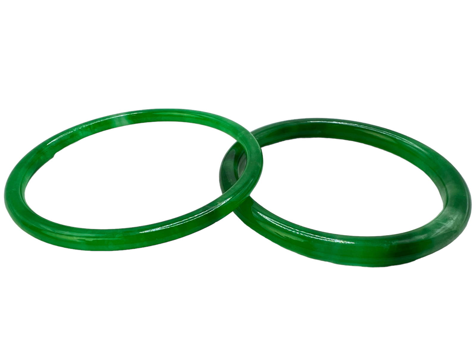 Two Jade / Green Stone Bangles Auction