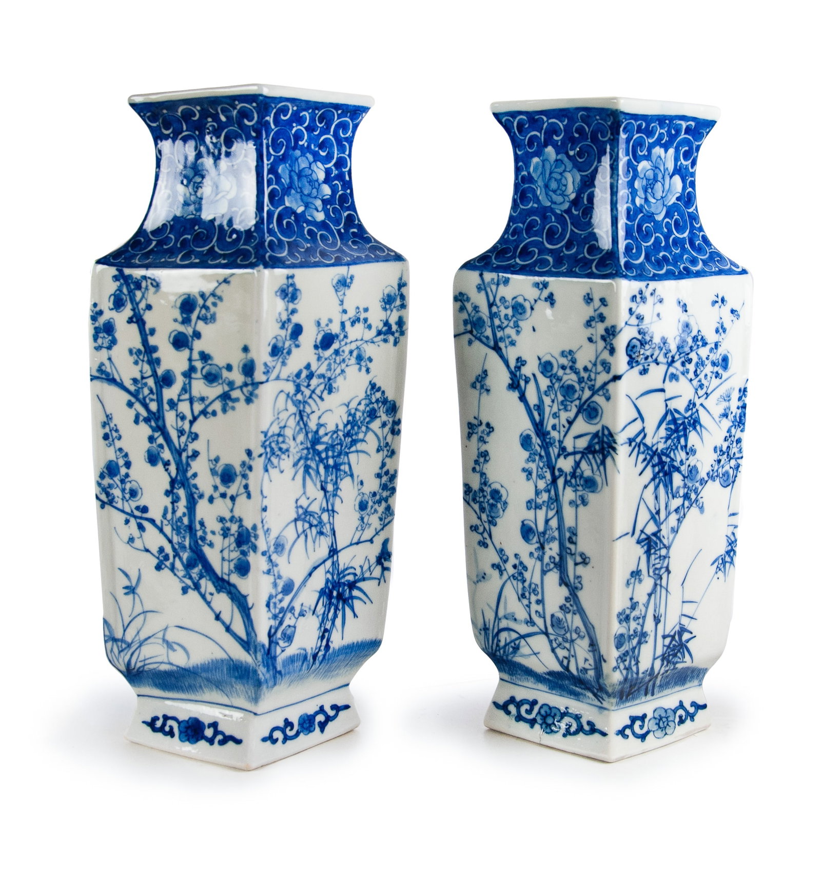 BLUE AND WHITE SQUARE BALUSTER VASE: Of square baluster form, painted with plum blossoms, orchid, bamboo and chrysanthemum that is known as four gentlemen in Chinese classic literature, with peony flower decoration on the neck.H:11 1/2in