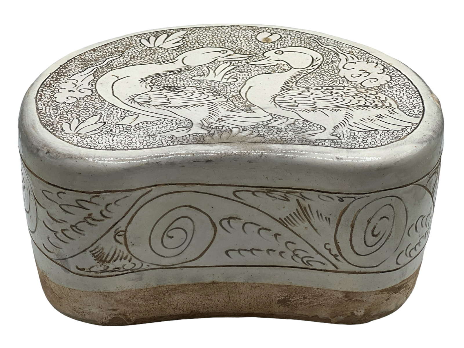 A Chinese White Glazed Porcelain Pillow: H: 4 inches (10.16 cm) W: 8 inches (20.32 cm) D: 5 1/2 inches (13.97 cm)