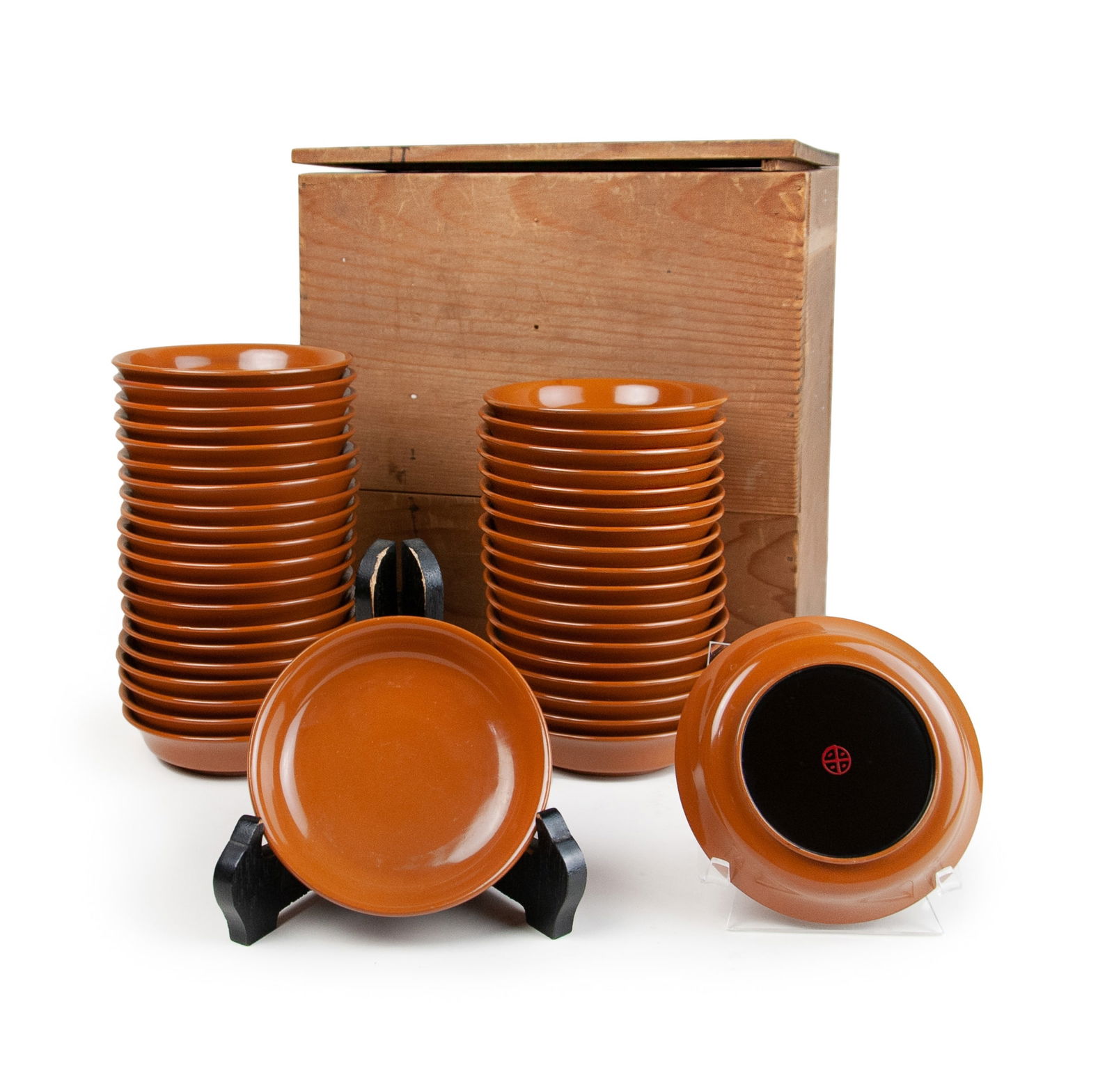 FORTY PIECE SET OF LACQUER DISHES: Signed on the lower right “BLS” by Brett Livingstone Strong. The image depicts two vases, one with a bouquet of white tulips, the other with a single white tulip, and there is a flying saucer