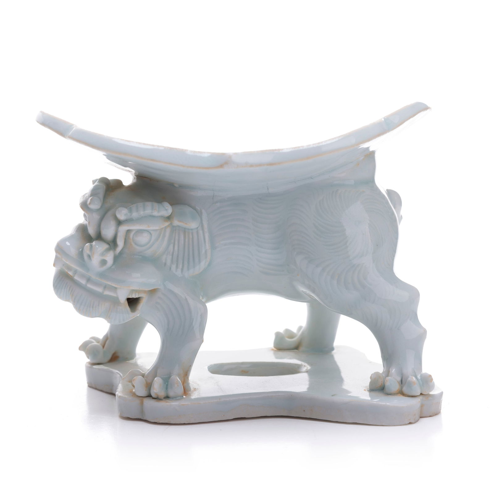 A Chinese Porcelain Whitle Glazed Lion Pillow: H: 1 3/4 inches W: 3 3/4 inches