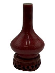 A Chinese Red Glazed Vase with Wood Stand