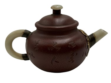 A YIXING Purple Clay Teapot with Jade Mouth and Ha