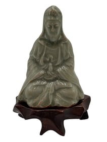 A Chinese Celadon FIgure of GUANYIN With Stand