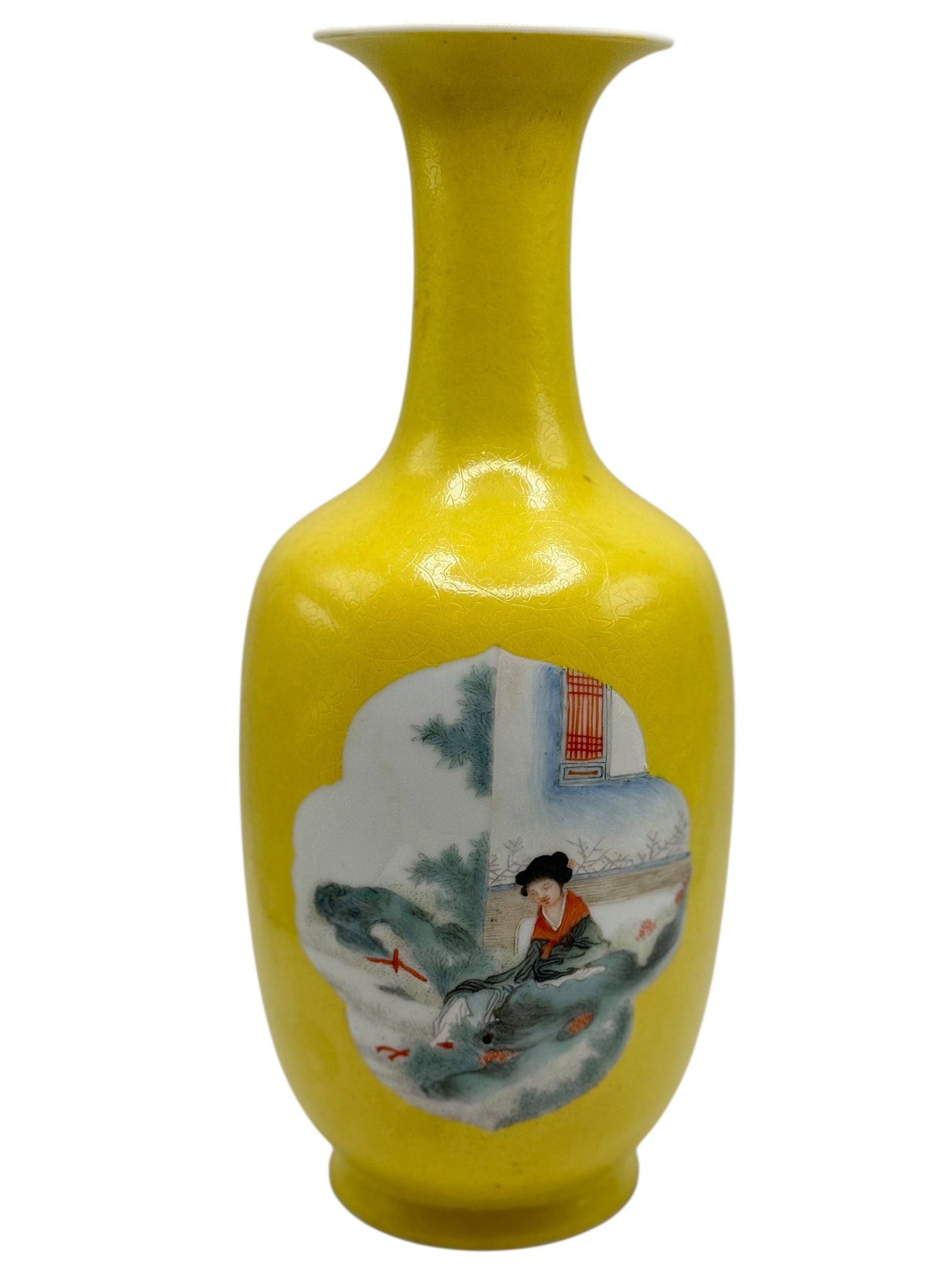 A Chinese Famille Rose Vase on a Yellow Ground: Of slender form with a flaring rim, the exterior covered in a yellow ground finely decorated with incised floral patterns. A shaped panel depicts a lady seated in a garden landscape. H: 9 3/4 inches