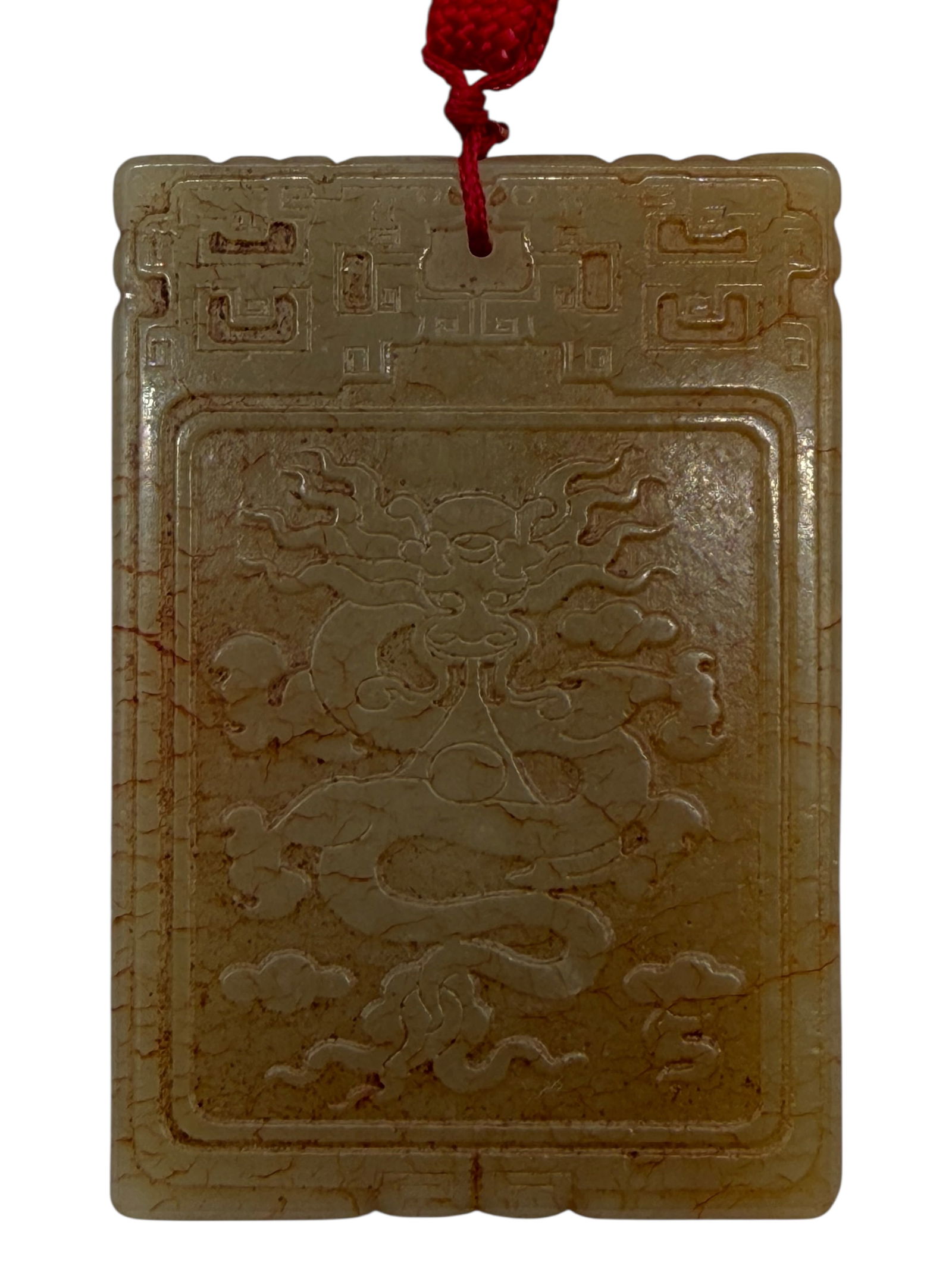 A Chinese Carved Jade Plaque with Dragon and Inscr: Rectangular jade plaque carved in low relief with a frontal dragon amid scrolling clouds within a recessed panel, the border carved with archaistic geometric motifs. The reverse incised with a 