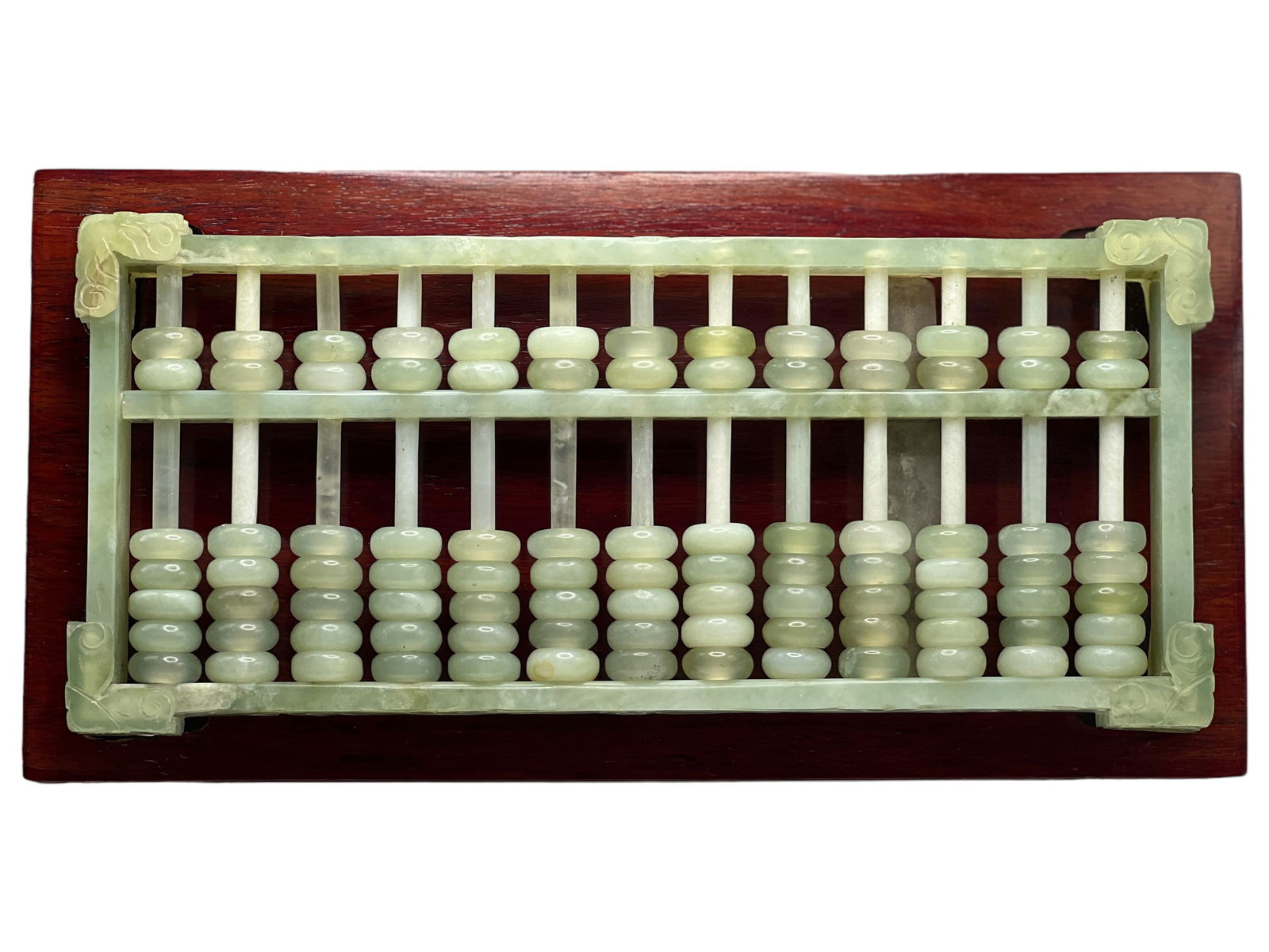 A Jade Abacus / Account Counter: H : 5 1/4 in ( 13.34 cm ) W : 11 3/4 in ( 29.85 cm ) L : 1 1/4 in ( 3.18 cm )