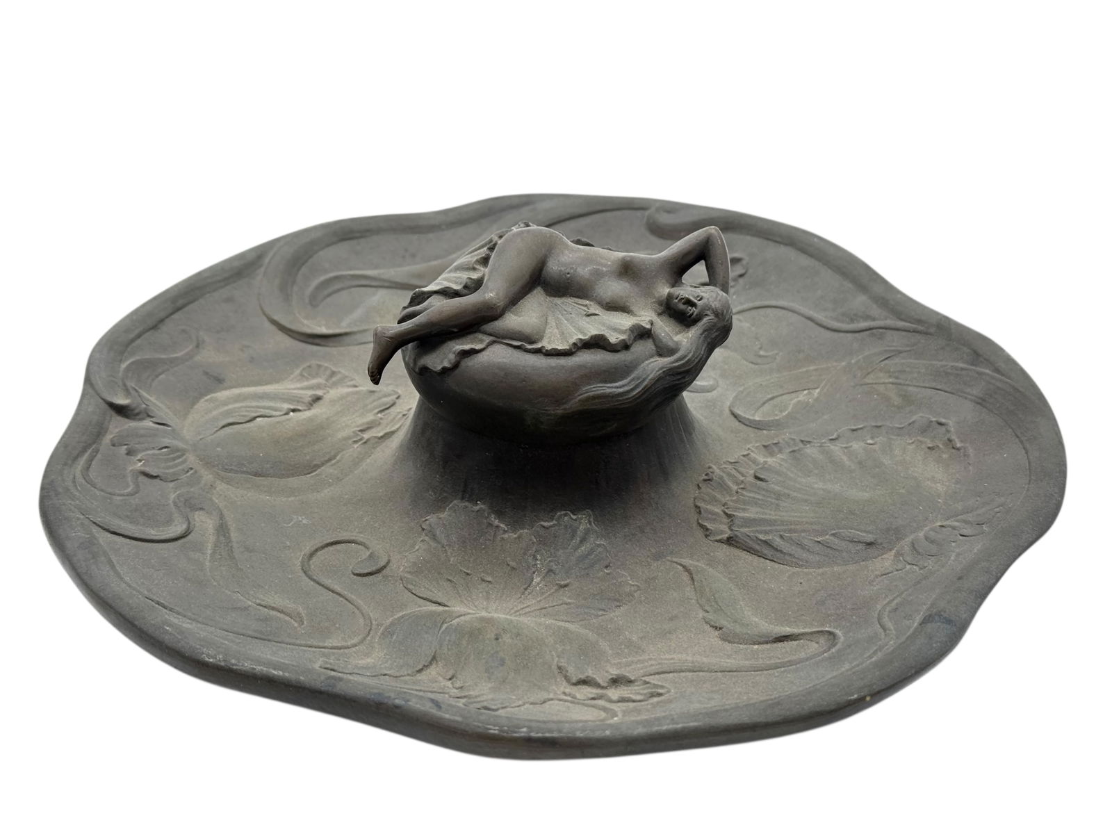 An Art Nouveau patinated metal inkwell with glass: D: 9 1/2 inches