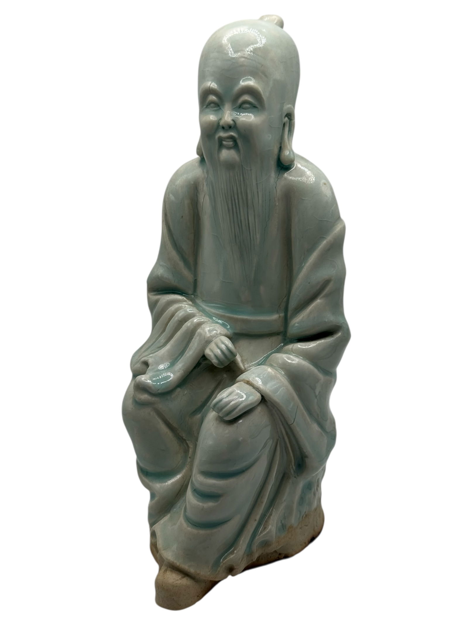 A Chinese Celadon-Glazed Standing Figure: H: 9 1/4 inches W: 3 3/4 inches D: 4 inches