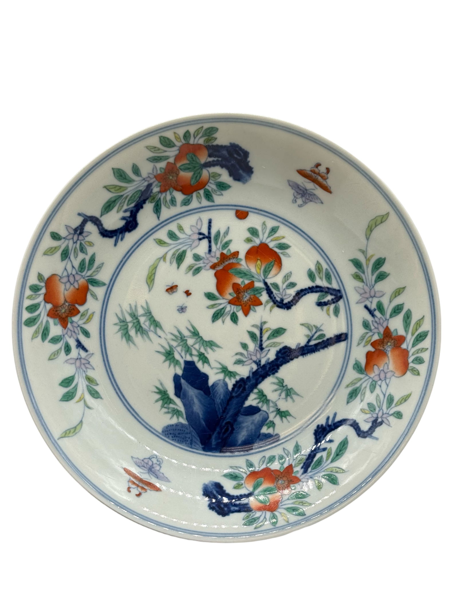 A Chinese Doucai Porcelain Dish: H: 1 1/2 inches W: 7 1/4 inches